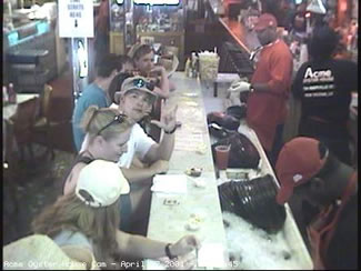 The gang and I hanging out at the Acme Oyster House in New Orleans. This picture was taken during the Jazzfest 2001 by the webcam at the end of the bar. 