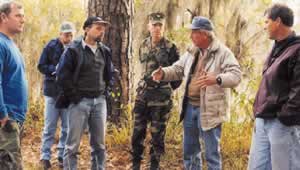 Neel describes the workings of a healthy  longleaf pine ecosystem. Photo by Richard T. Bryant. Email richard_t_bryant@mindspring.com