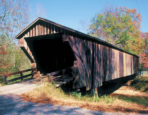 Big Red Oak Creek Covered Bridge, erected on a tributary of the Flint River in Meriwether County, was built in the 1840s by former slave Horace King. It is the oldest covered bridge in Georgia and the longest wooden bridge.  Photo by Richard T. Bryant. Email richard_t_bryant@mindspring.com