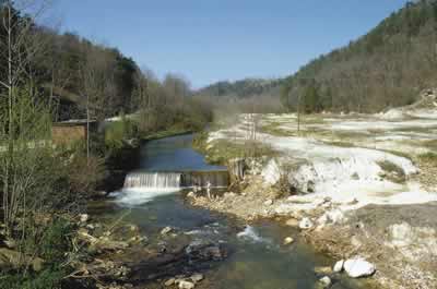 Figure 18. Abandoned marble quarry contributing to sedimentation of Cove Creek, Pickens County, GA (photograph by N. M. Burkhead).